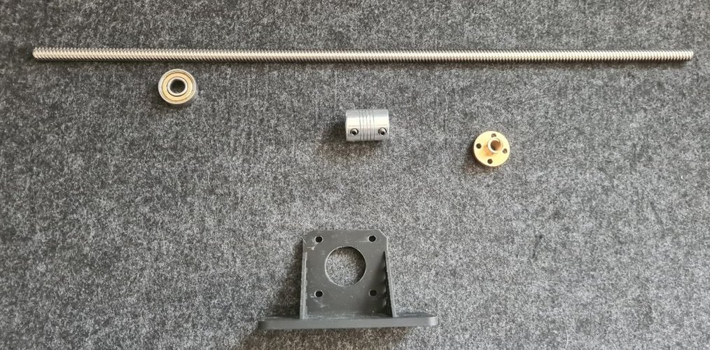 Components for one leg laid out: TR8 lead screw, 608ZZ bearing, flexible coupling 5x8, brass TR8 nut and a 3D-printed motor mount in PLA.