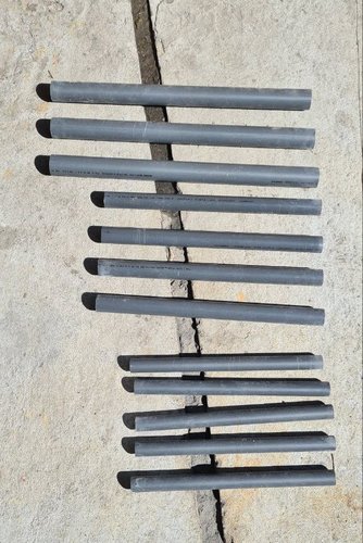 All twelve PVC pipe sections (3 per leg × 4 legs) cut to length and laid out on the floor.