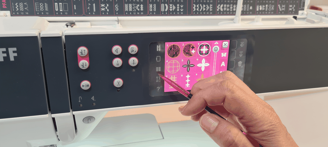 Machine screen showing the built-in embroidery design library: a numbered grid of decorative motifs.