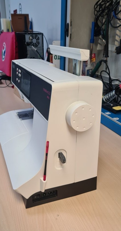 Right side of the machine: handwheel, side slot, PFAFF stylus, power switch and connector.