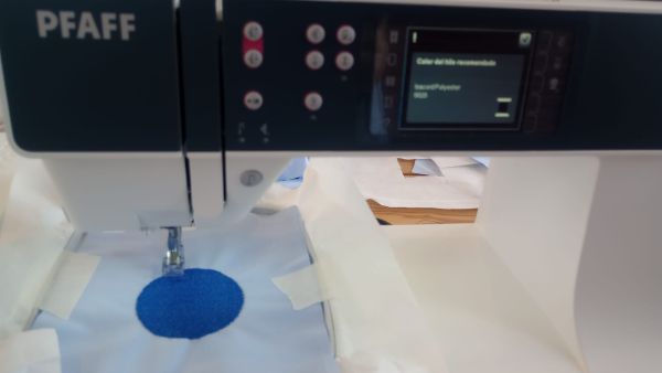 CNC embroidery machine producing the captain symbol
