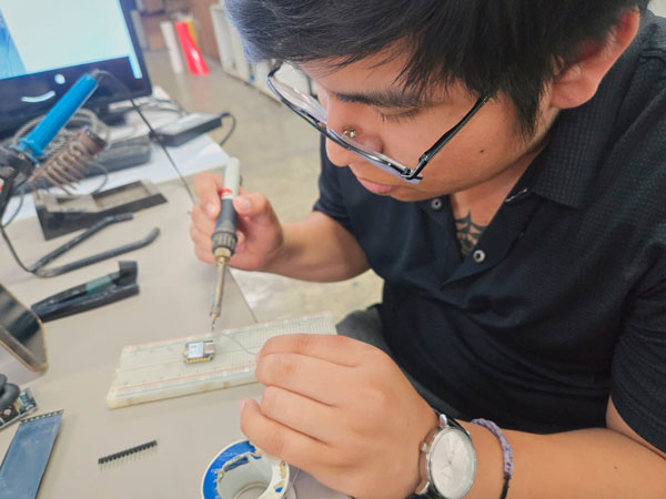 Esteban soldering XIAO ESP32-C3