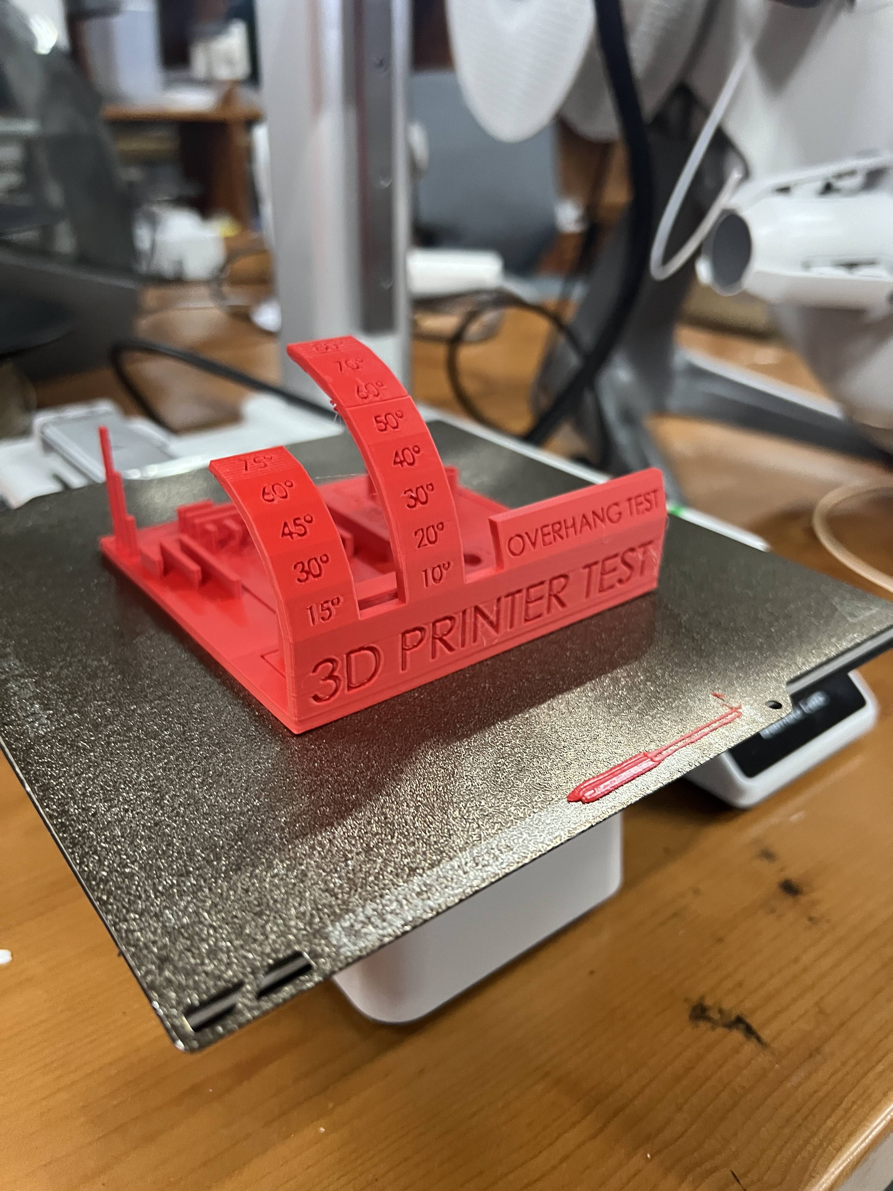 Red benchmark print produced on Bambu Lab A1 Mini