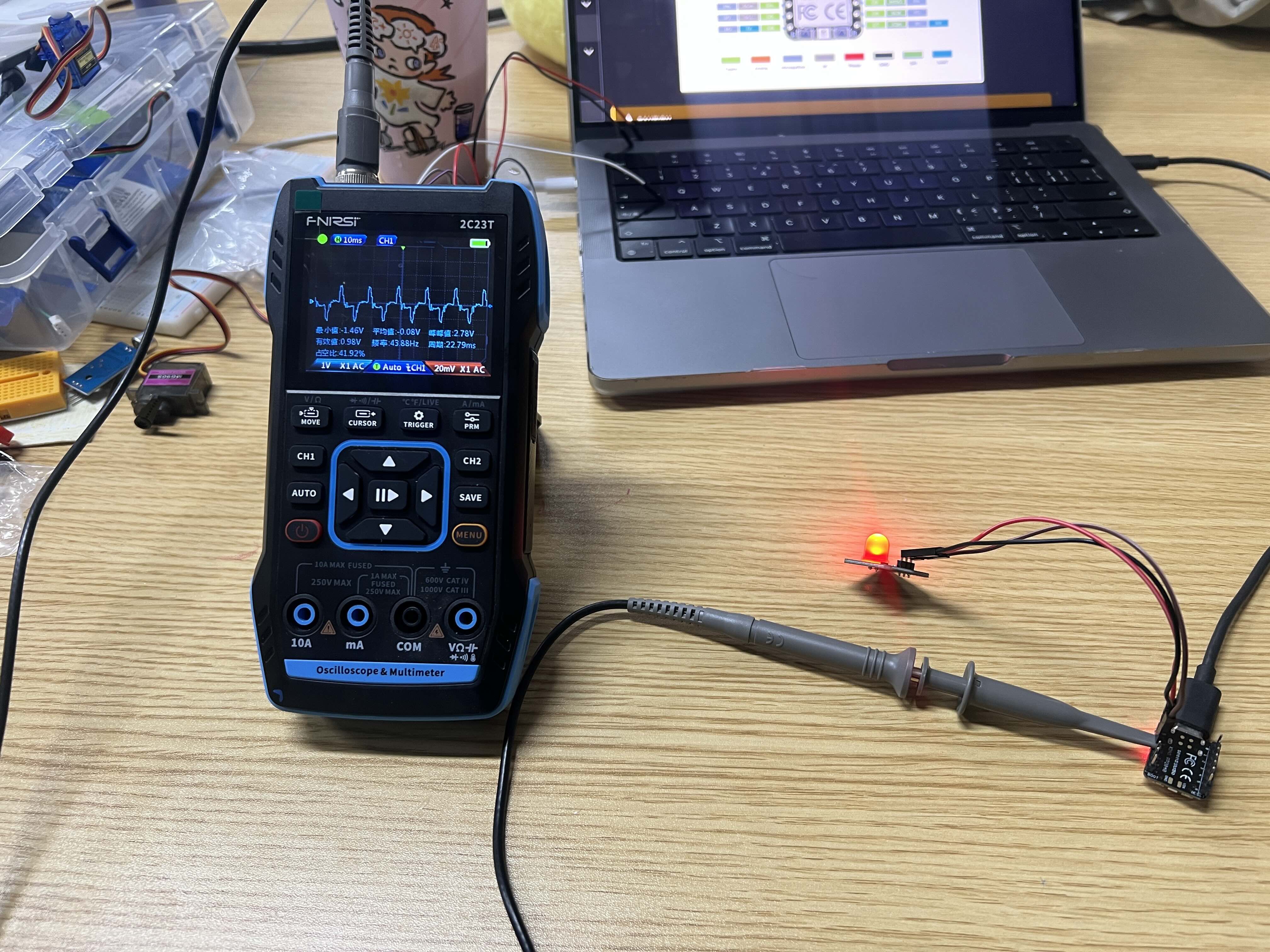 Oscilloscope connected to ESP32-based board and LED output
