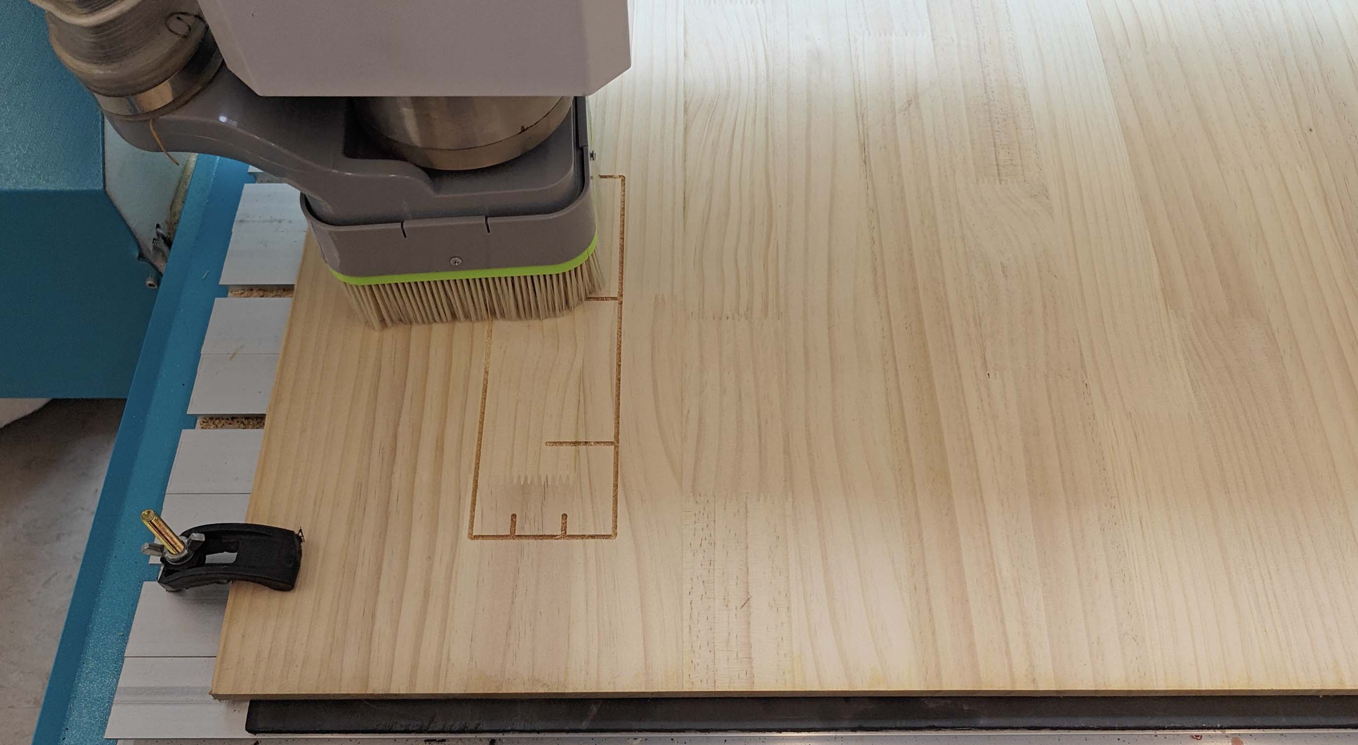Test cut on wooden sheet before the final CNC job