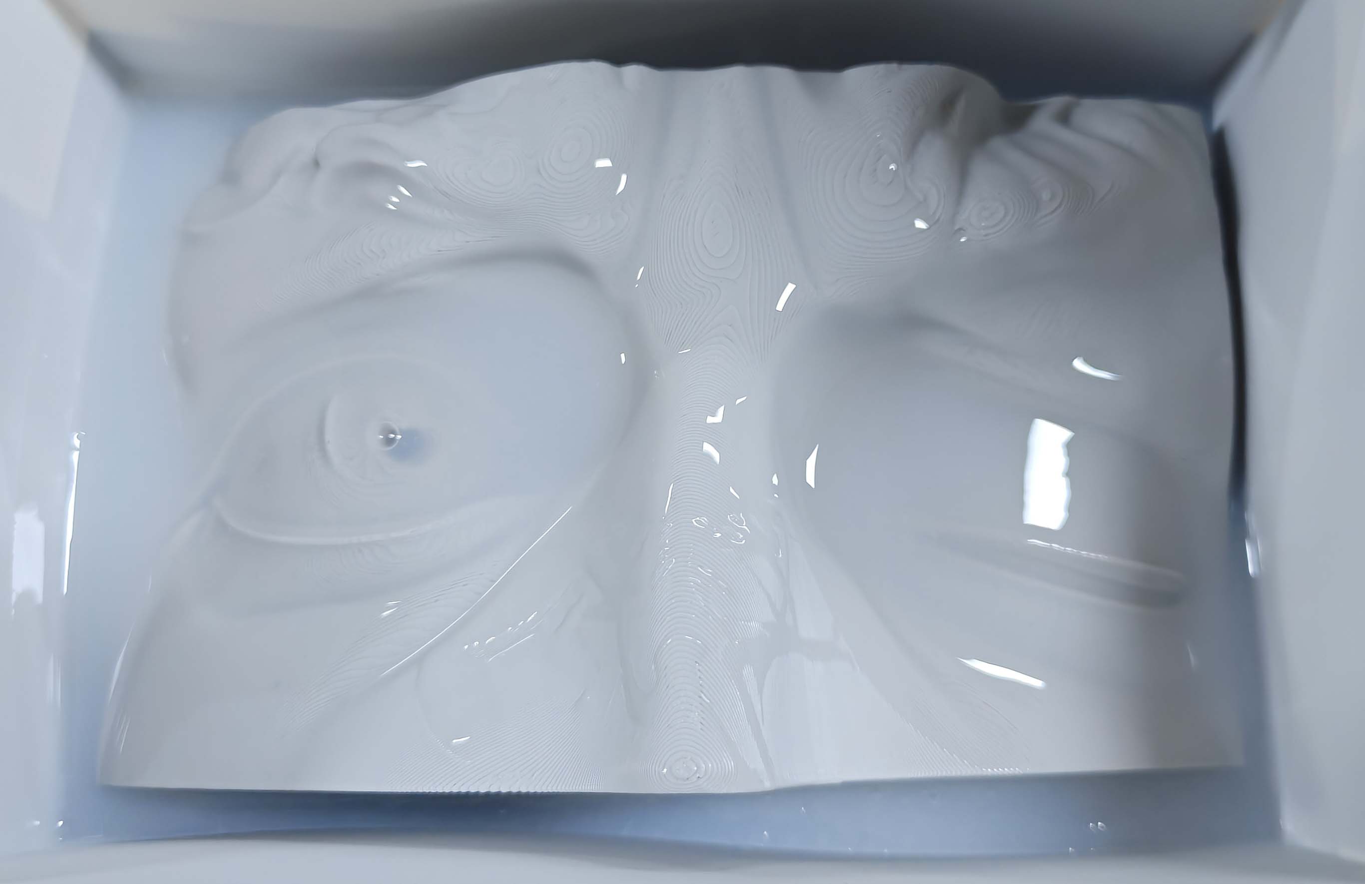 Pouring silicone into the mold box