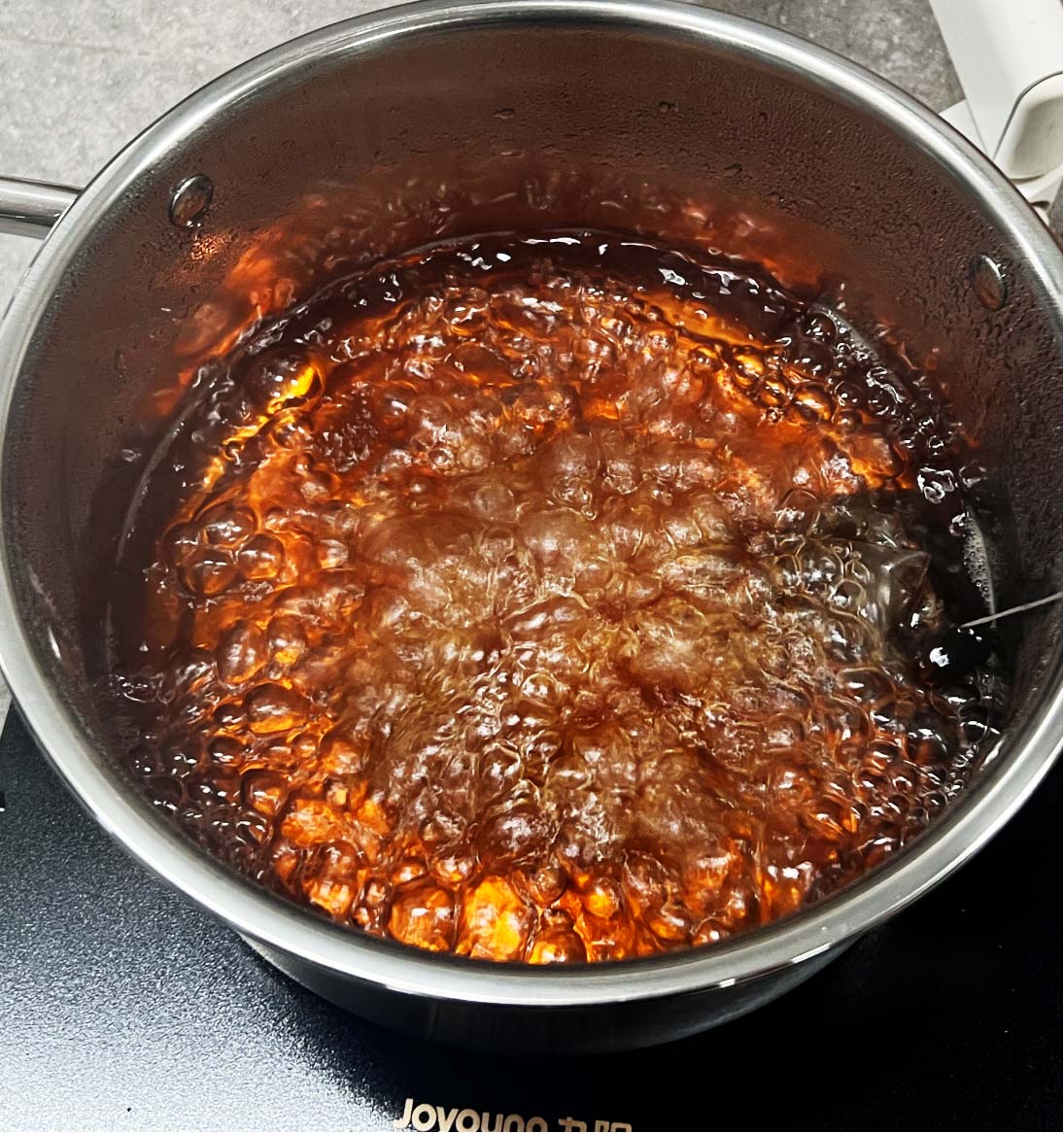 Heating amber-colored bio-material mixture