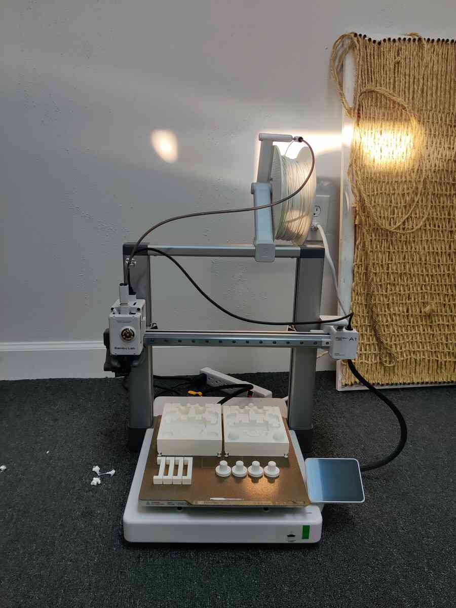 Bambu Lab 3D printer with completed mold parts on the print bed