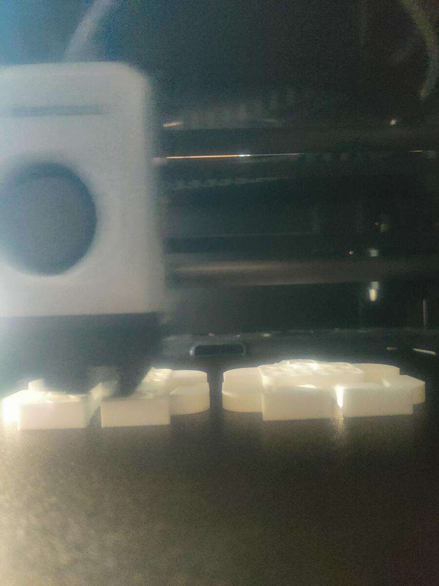 Close-up inside printer showing early layers of the mold base