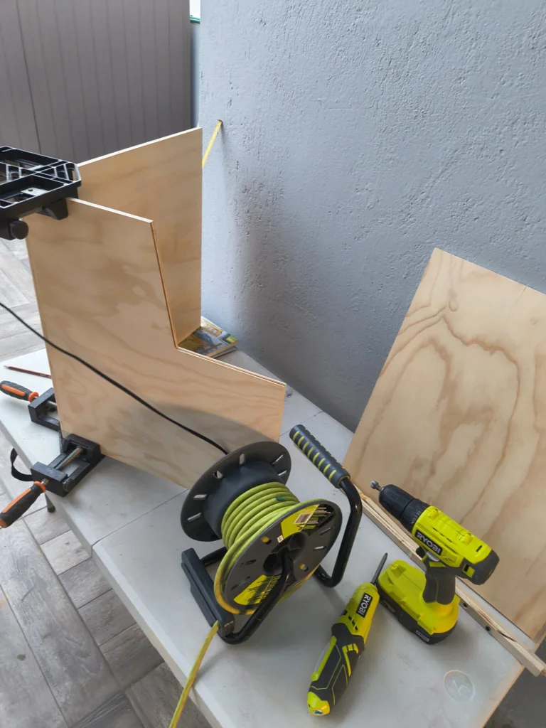 Base assembly with corner clamps