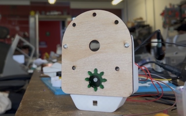 First 3D printed test of the back housing section showing button and servo placement