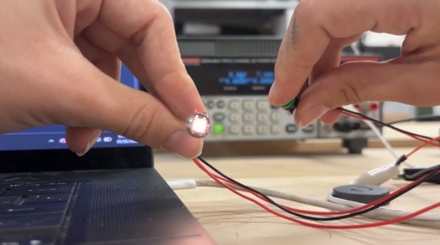 NeoPixel LED illuminated during the color cycle test, showing successful connection