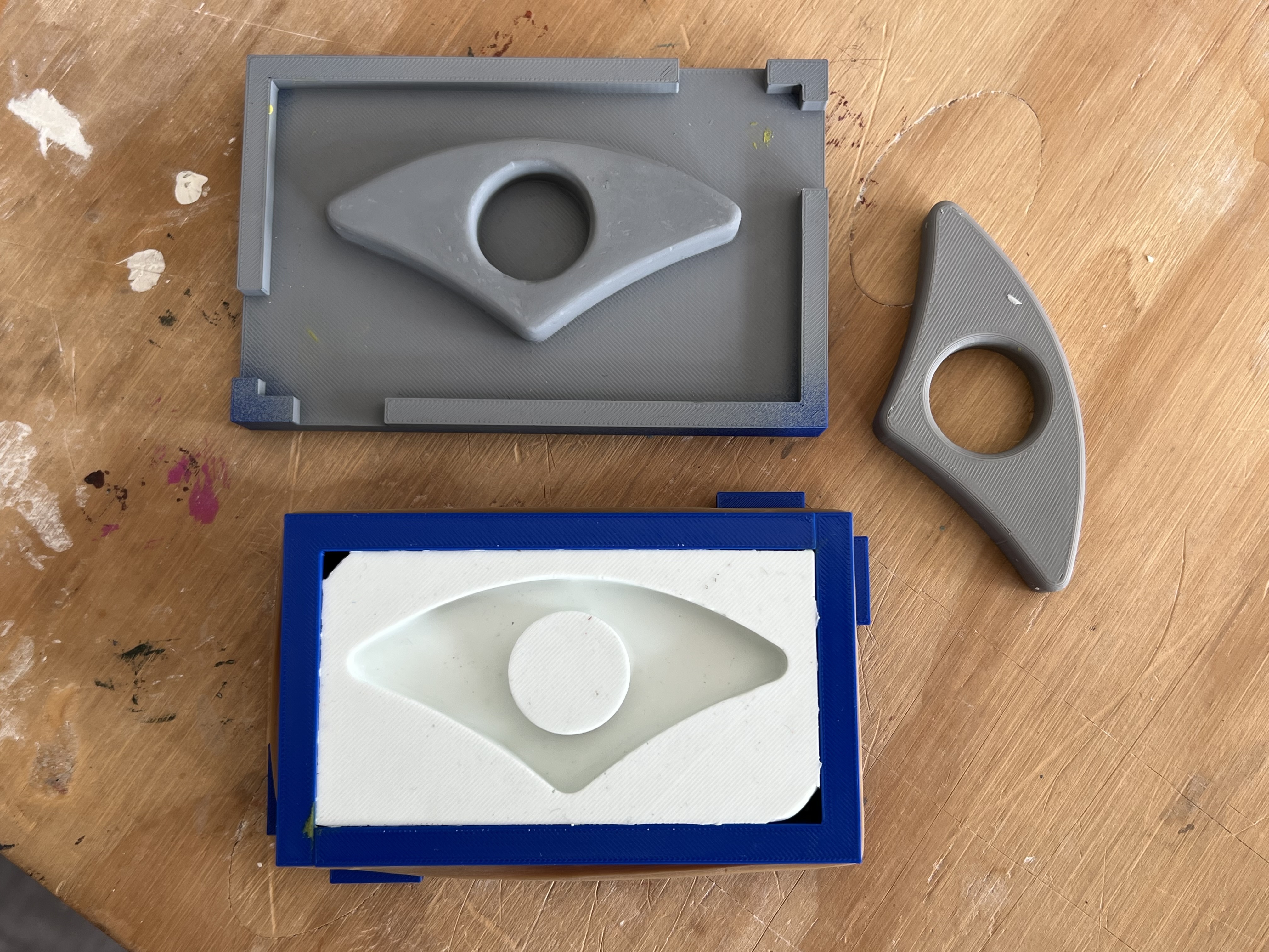Silicone mold after curing and demolding from the three-part PLA counter-mold, showing a clean surface finish