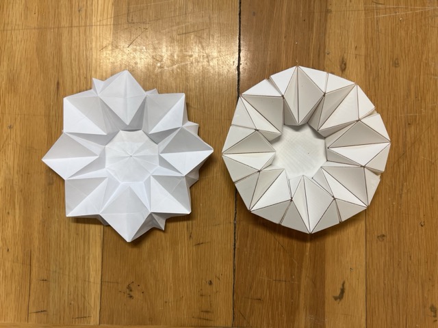 Final kinetic origami panel in its fully closed state — the flower-like structure contracted by the servo mechanism