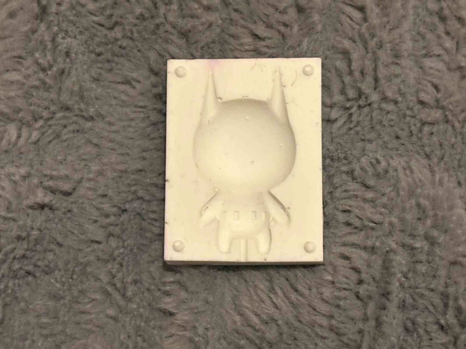 The two silicone mold halves joined together