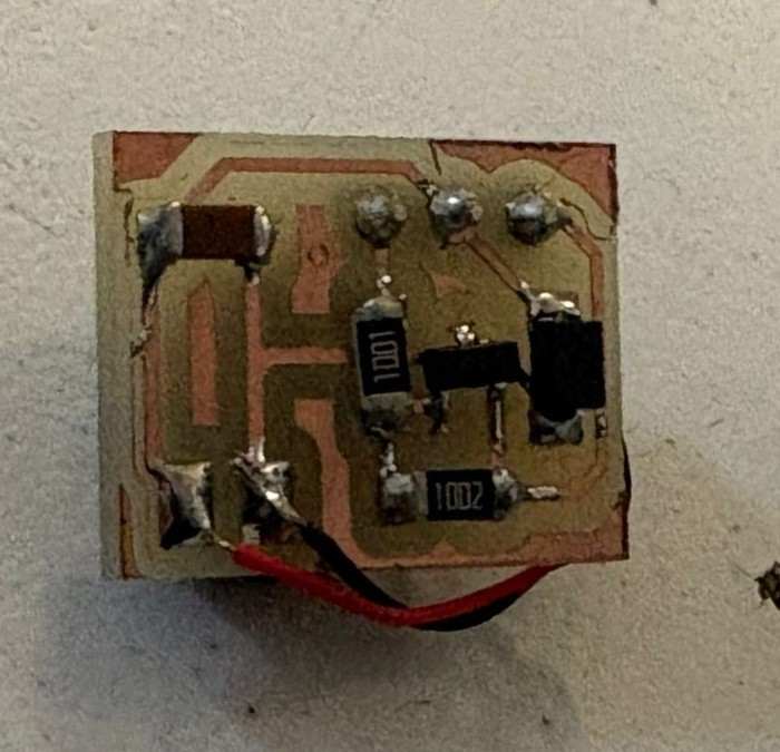 Custom motor driver PCB with components soldered and wired to the XIAO