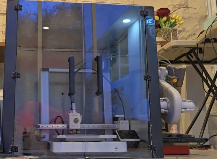 Finished PrintVault Pro enclosure, front view with the doors closed and the print visible inside