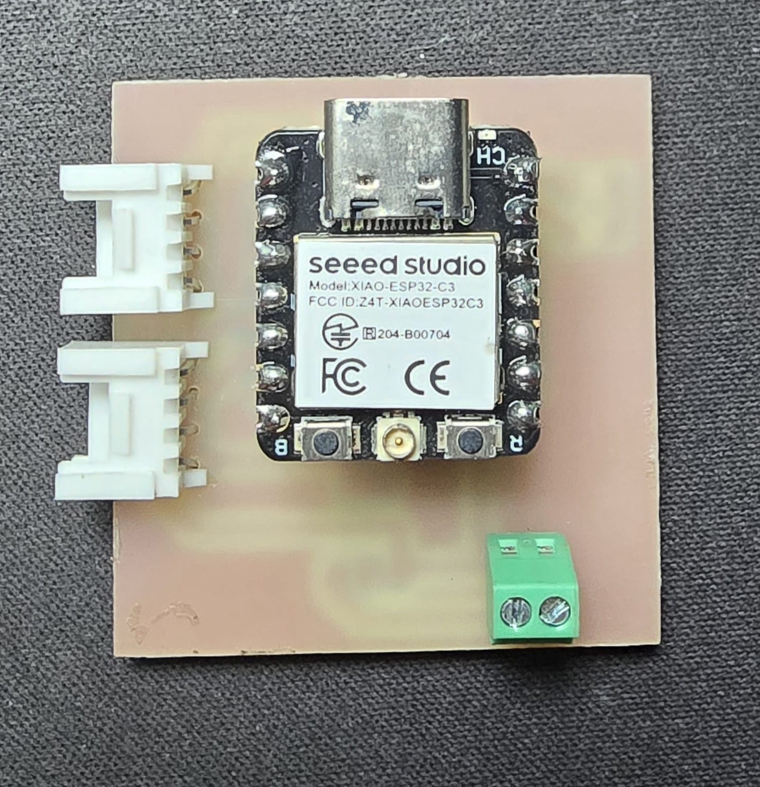 3D render of the second PCB design showing the XIAO, regulator, sensor, display, fan and LED footprints