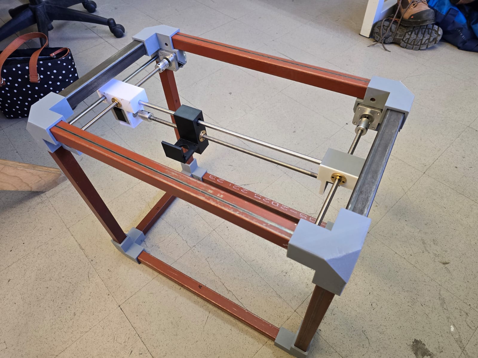 Isometric view of the assembled CNC frame showing the printed parts mounted on the aluminum structure