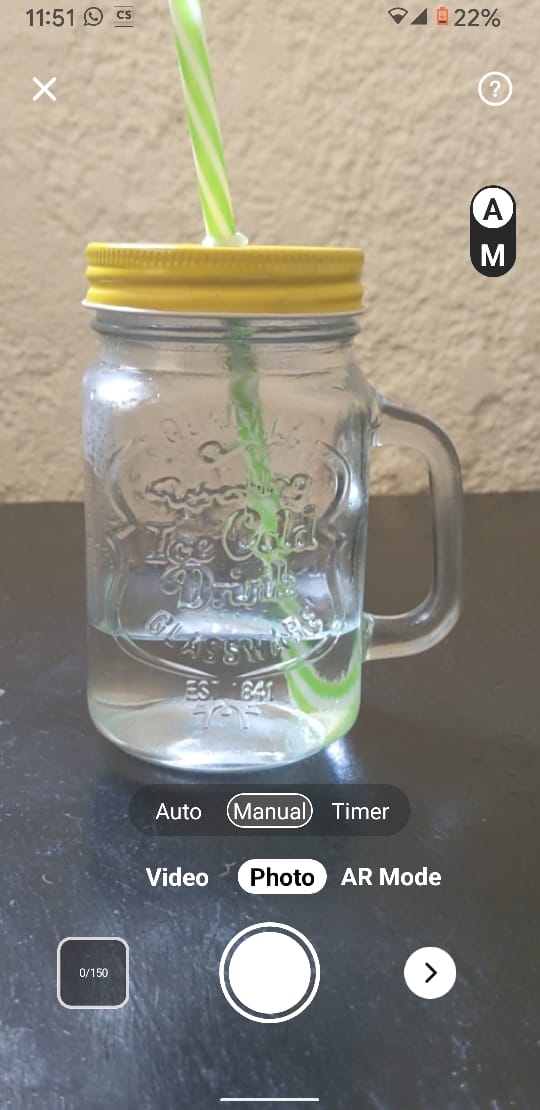 Starting photo capture of glass jar with straw