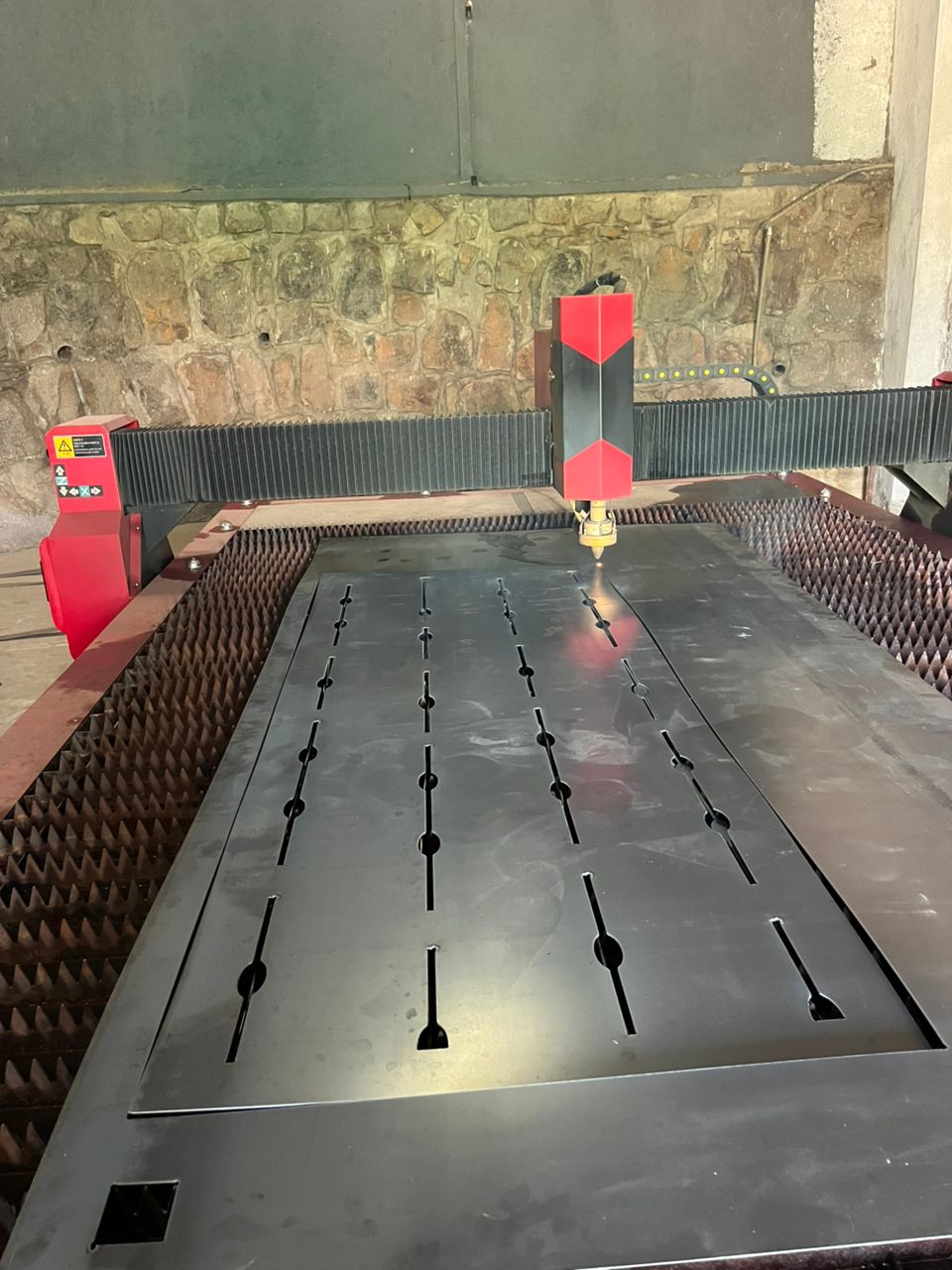 At the workshop, I prepared the plasma cutter before starting the cutting process.
