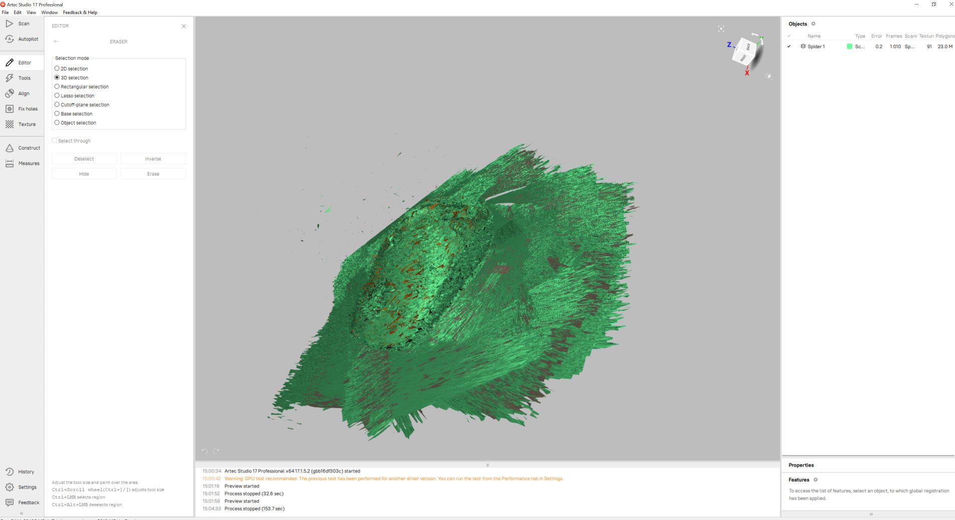 Displaying the uncleaned raw solid green geometric mesh data within the workspace environment, revealing significant surrounding background artifacts.