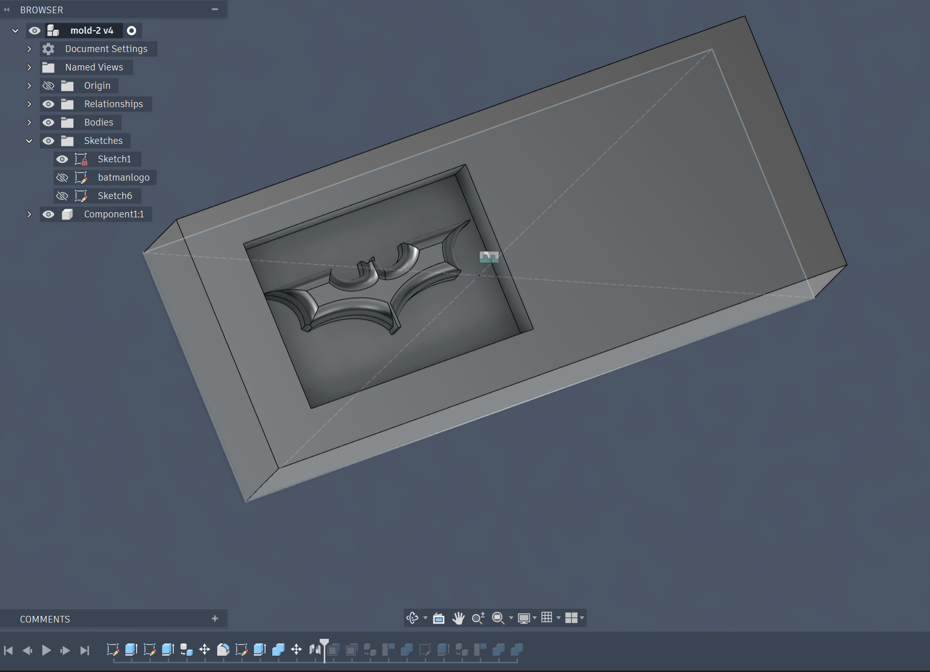 Extruding the batman logo and placing it 12mm under the top surface of the mold piece, it extudes 8mm