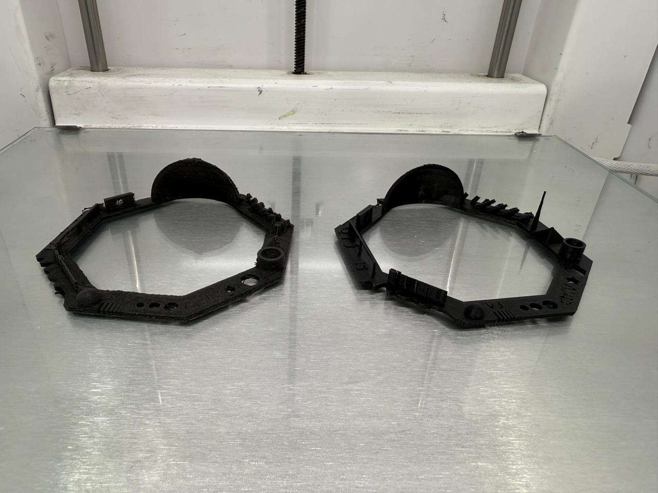 Side by side comparison of rough profile PLA versus clean generic PLA on print bed