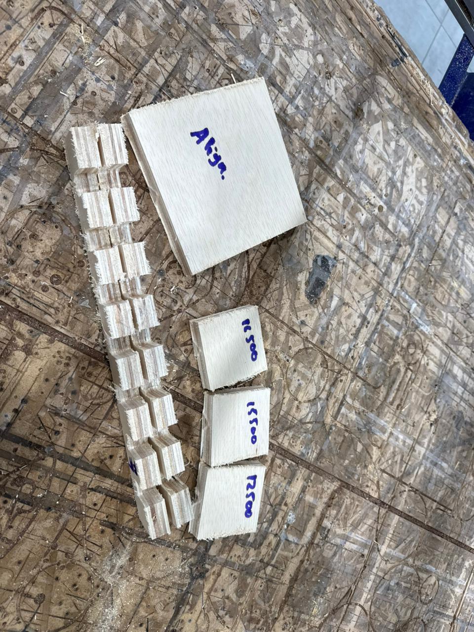 Fastening sheet to sacrificial spoilboard using screw-down perimeter layout tools