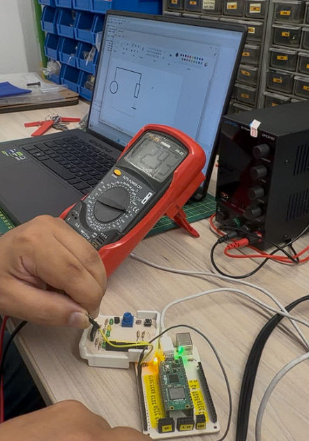 Multimeter measuring Pico PCB