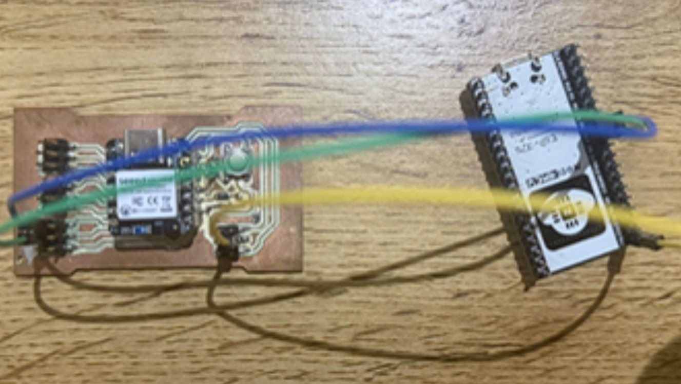 Two XIAO boards connected with communication wires