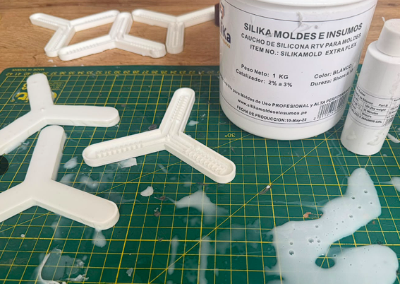 Poured molds next to Silika silicone container