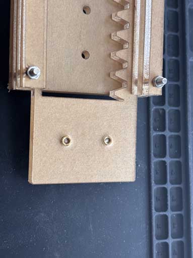 I used copper heat inserts to anchor the servo/end effector and to anchor the x axis gantry to the y axis gantry.