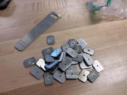 A pile of t-slot nutes