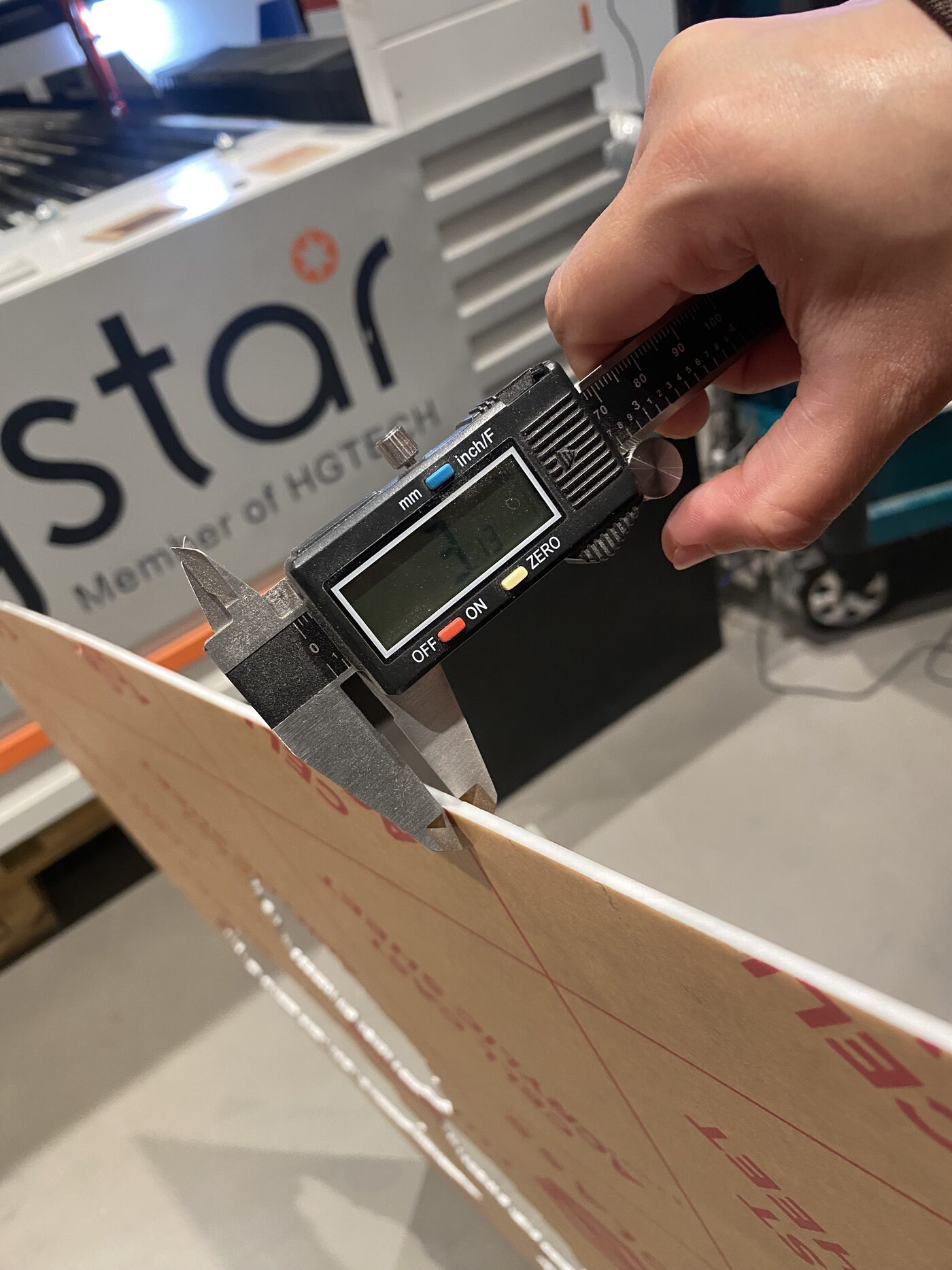 Measuring the thickness of the acrylic sheet with a digital caliper