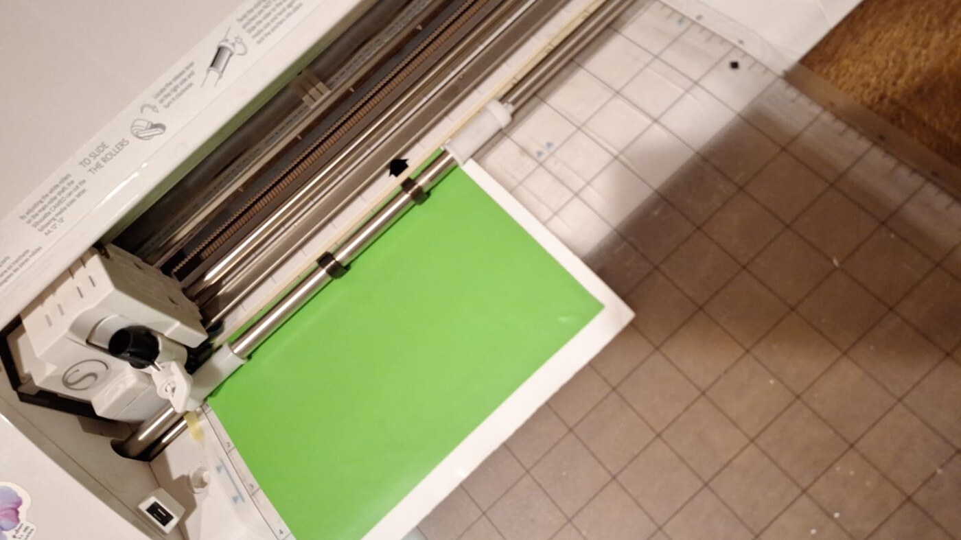 Cameo 4 vinyl cutter actively cutting the Fab Lab logo from a vinyl sheet
