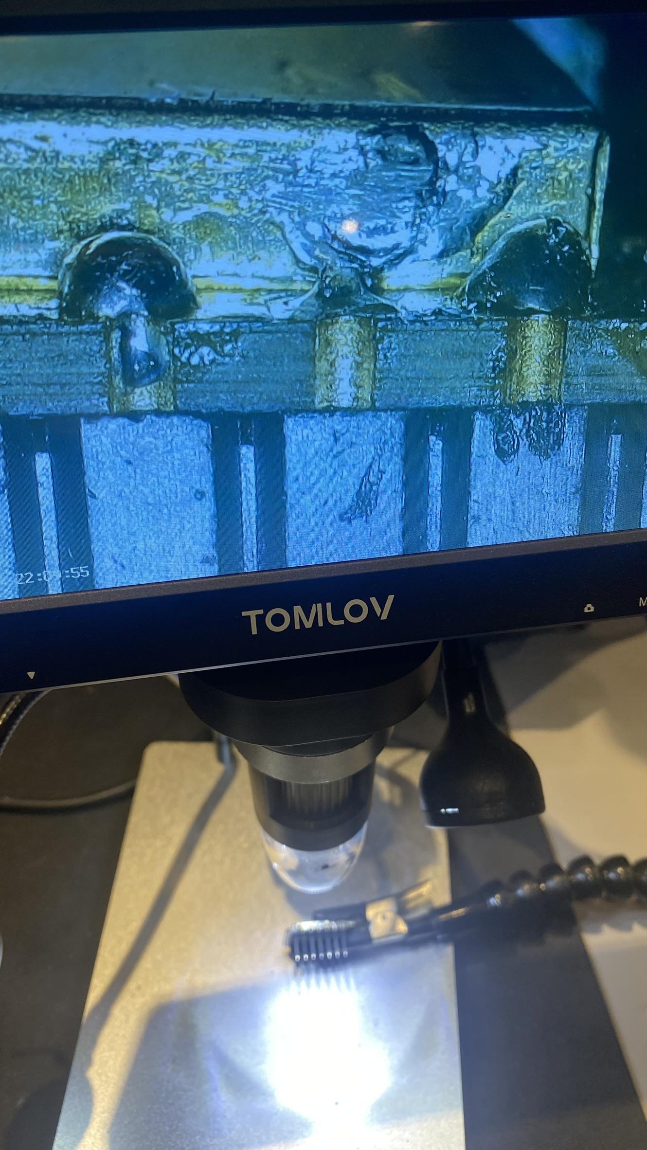 Tomilov digital microscope showing bridged solder joints on the header pins