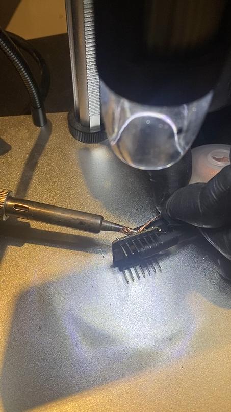 Cleaning bridged solder joints with soldering iron