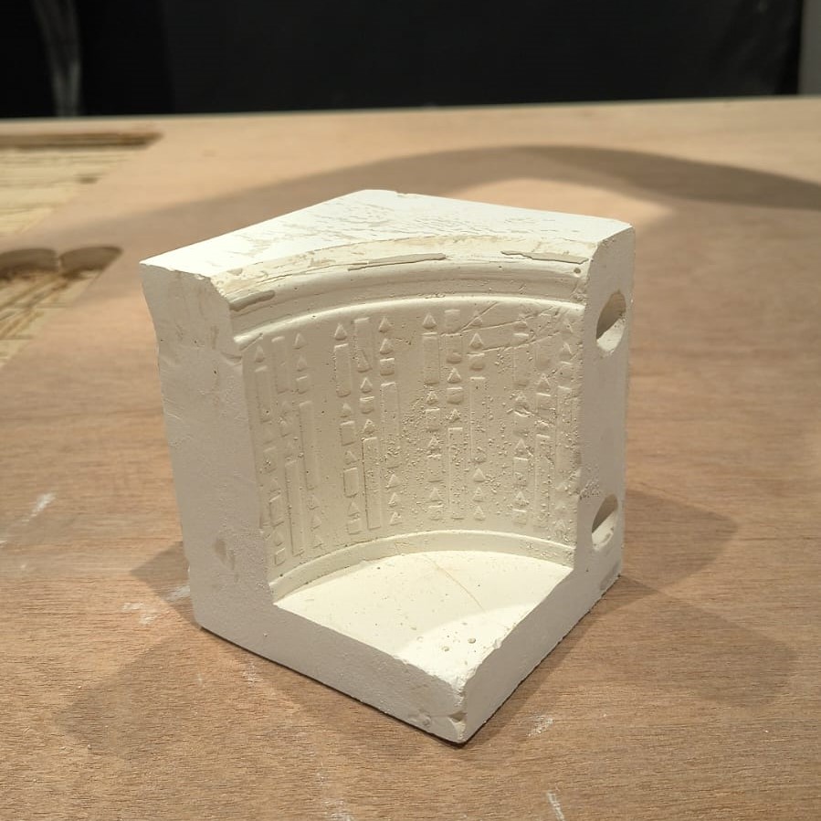 Single gypsum mold section after setting