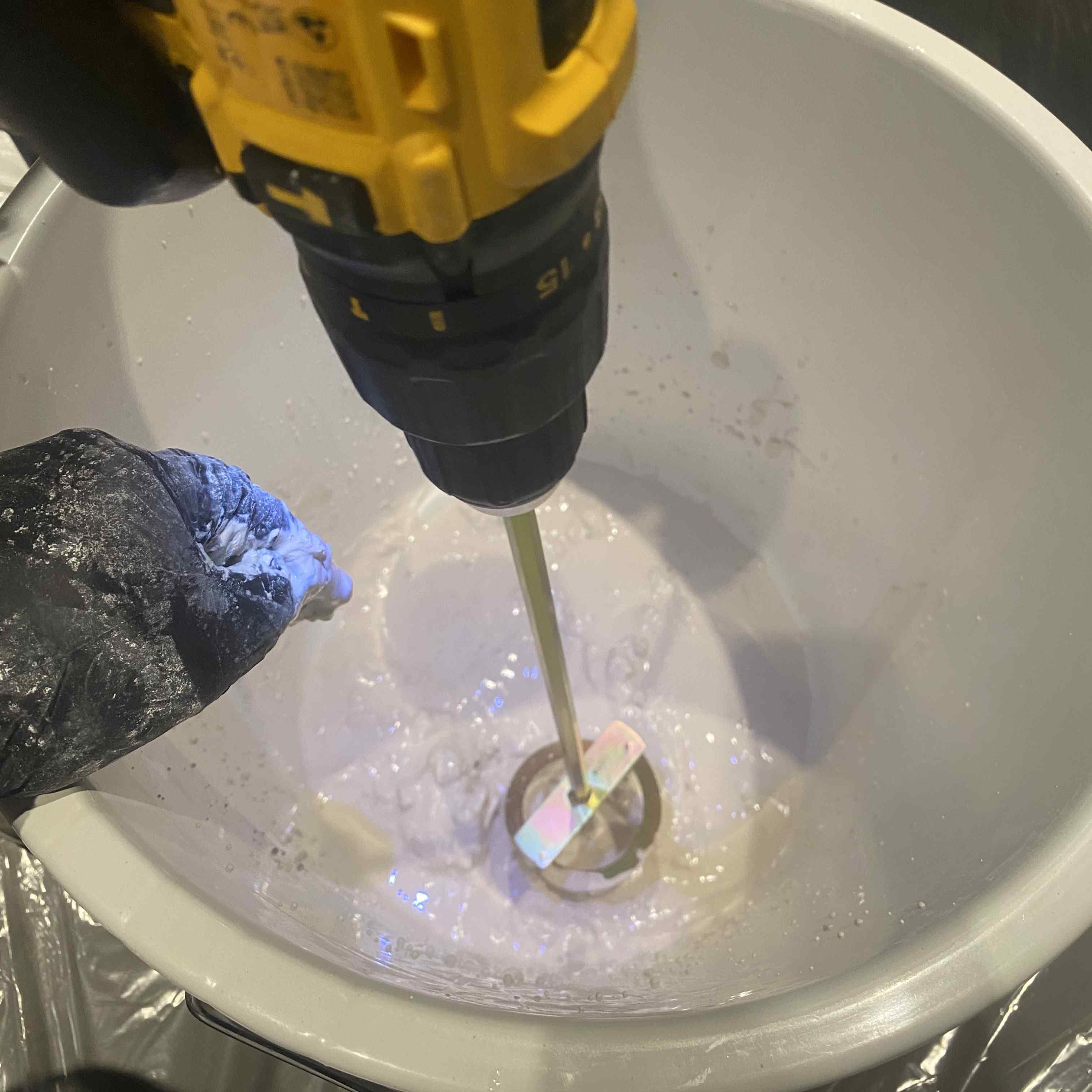 Mixing gypsum using a drill mixer