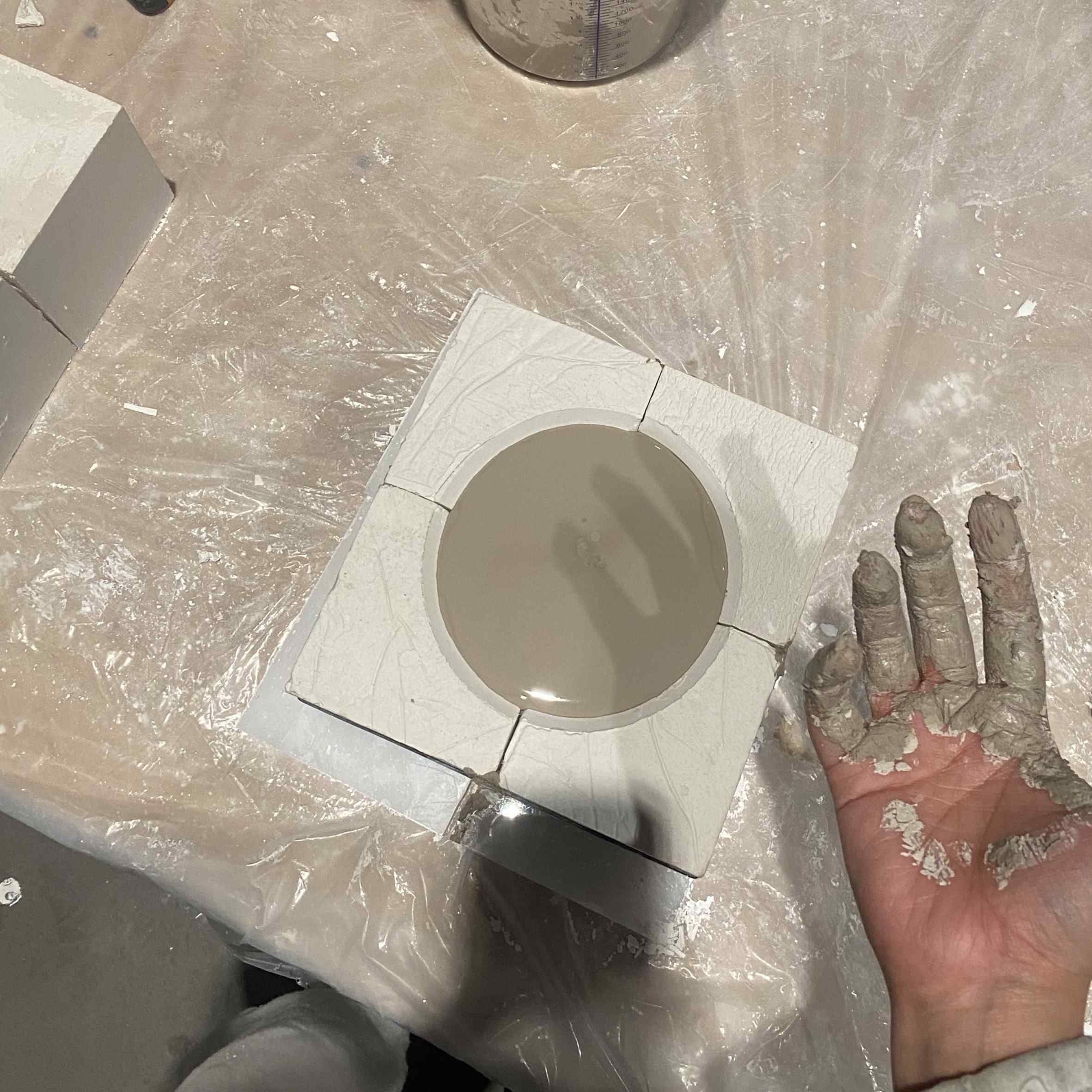 Slip being poured into the assembled mold