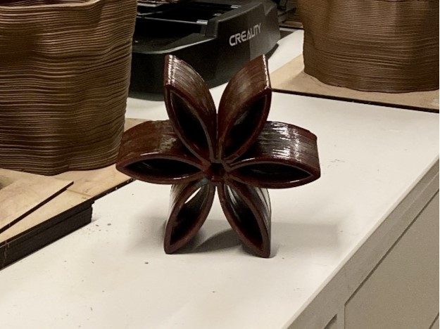 Final glazed Najdi Flower ceramic — after second kiln firing
