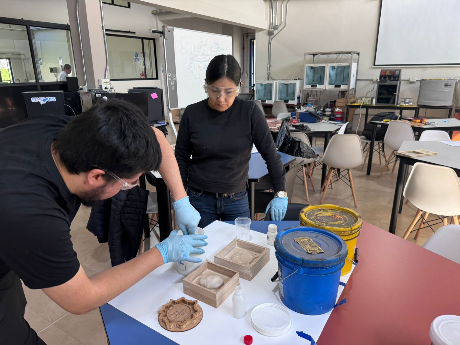 Group preparing silicone for test casting