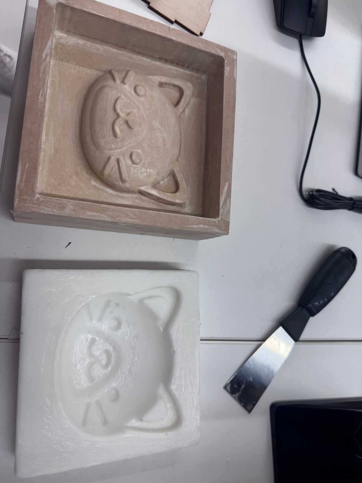 CNC milled cat mold compared with a 3D printed mold