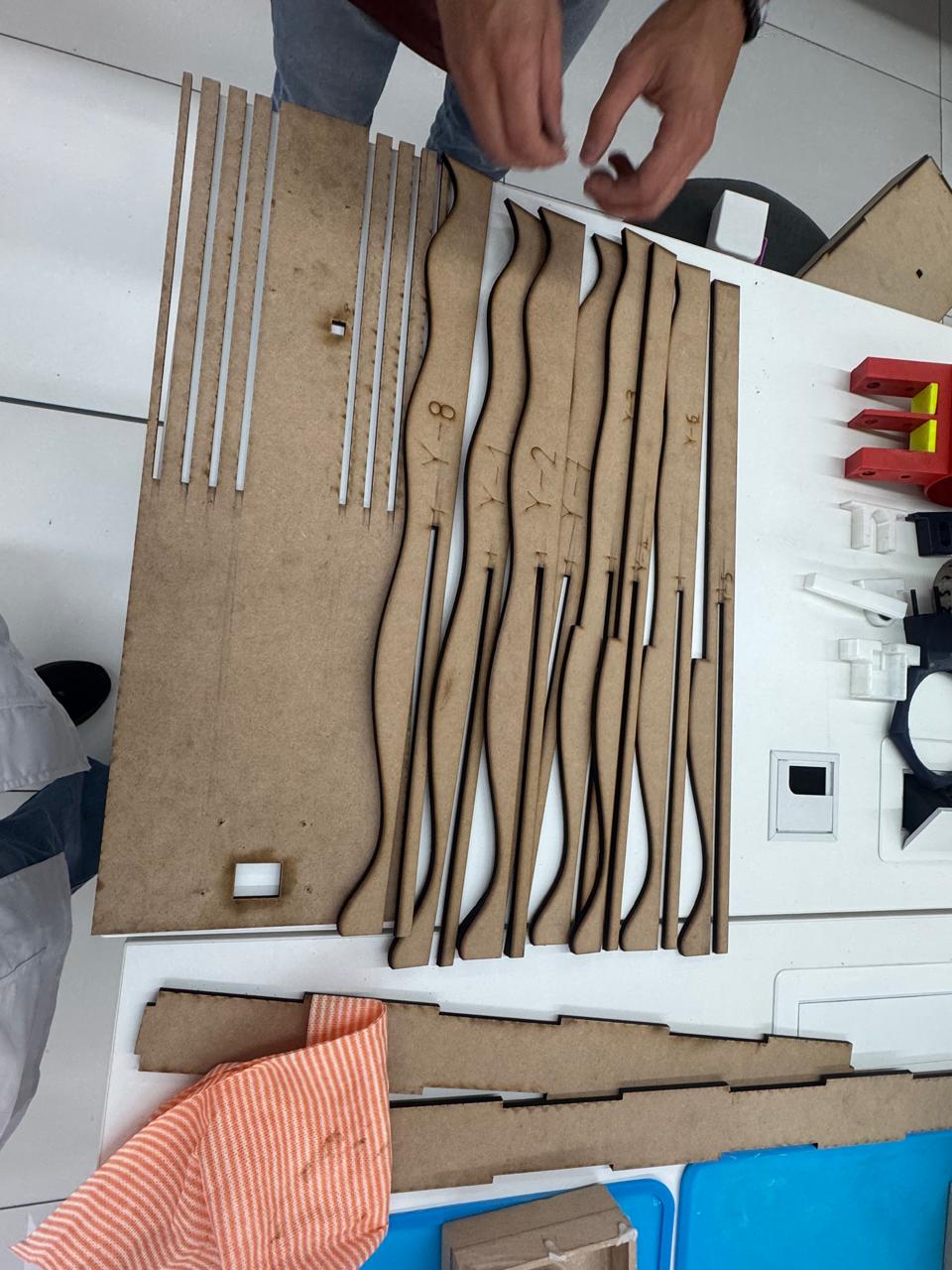 Laser cut MDF parts sorted before assembly