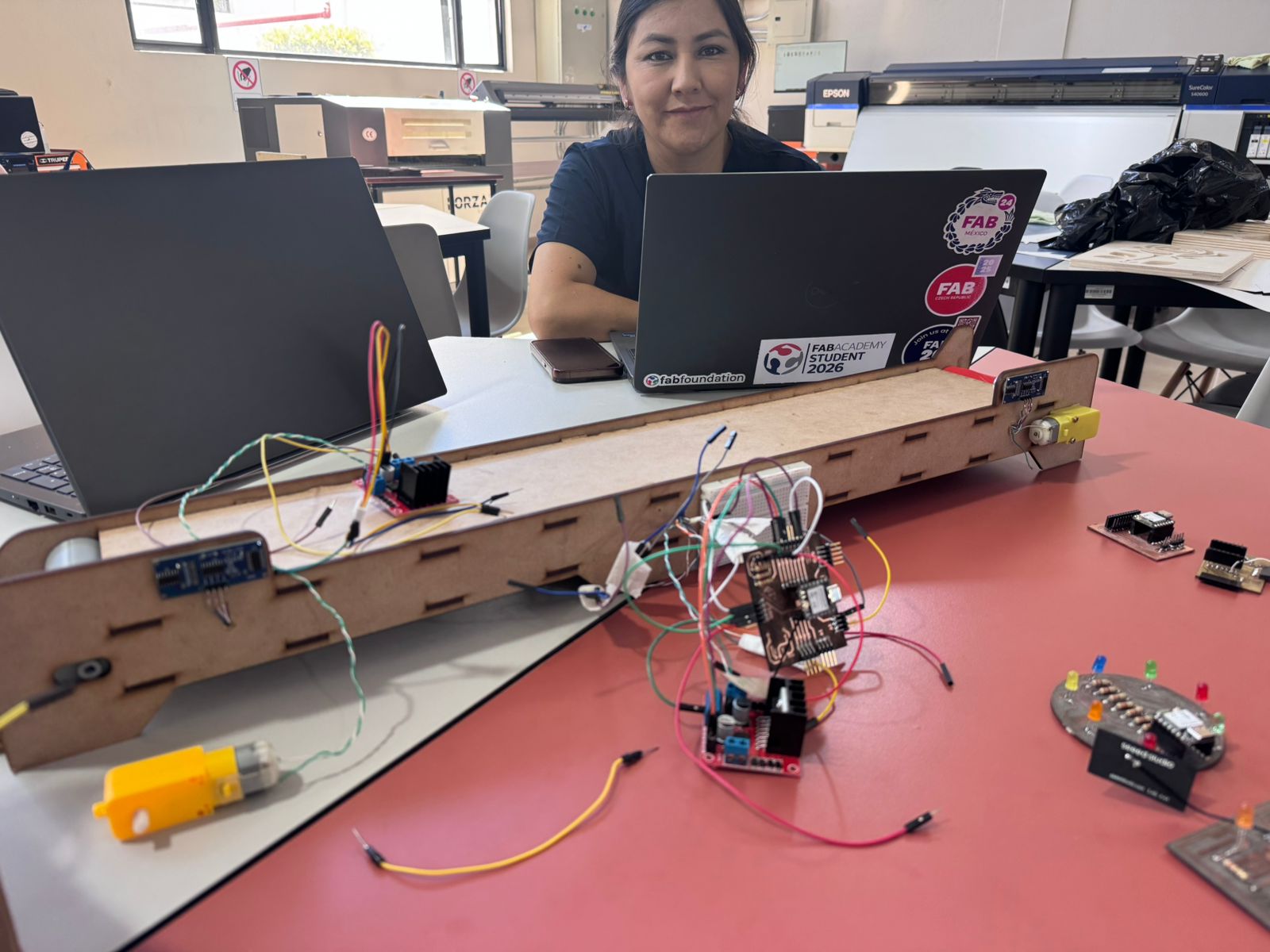 Jenny soldering components during machine integration