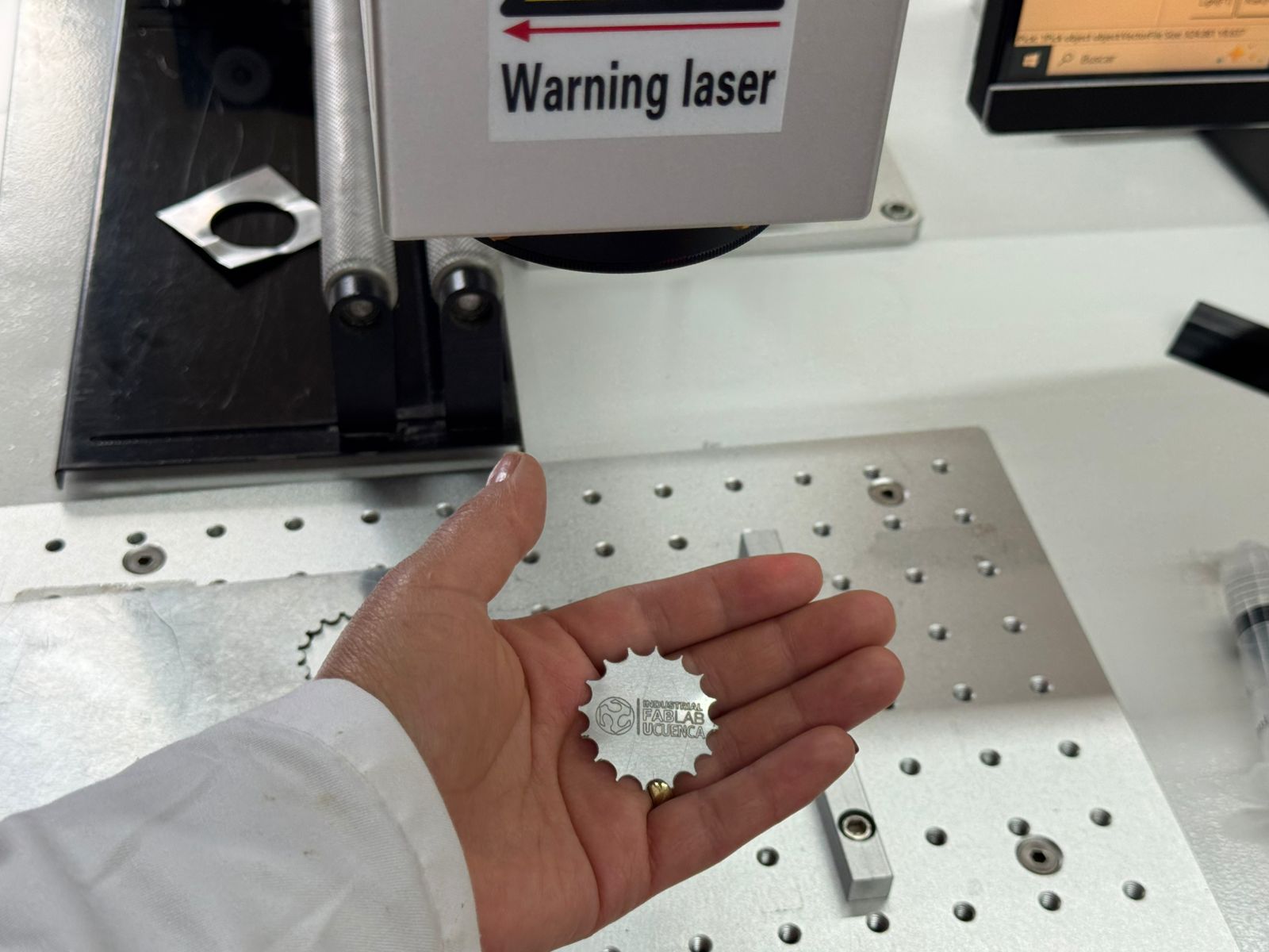 Final aluminum keychain presented in hand