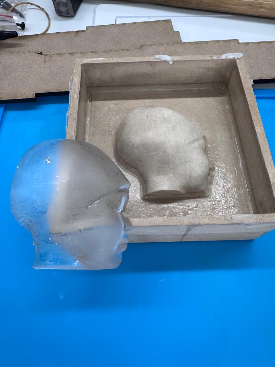 Transparent cast next to the MDF master mold