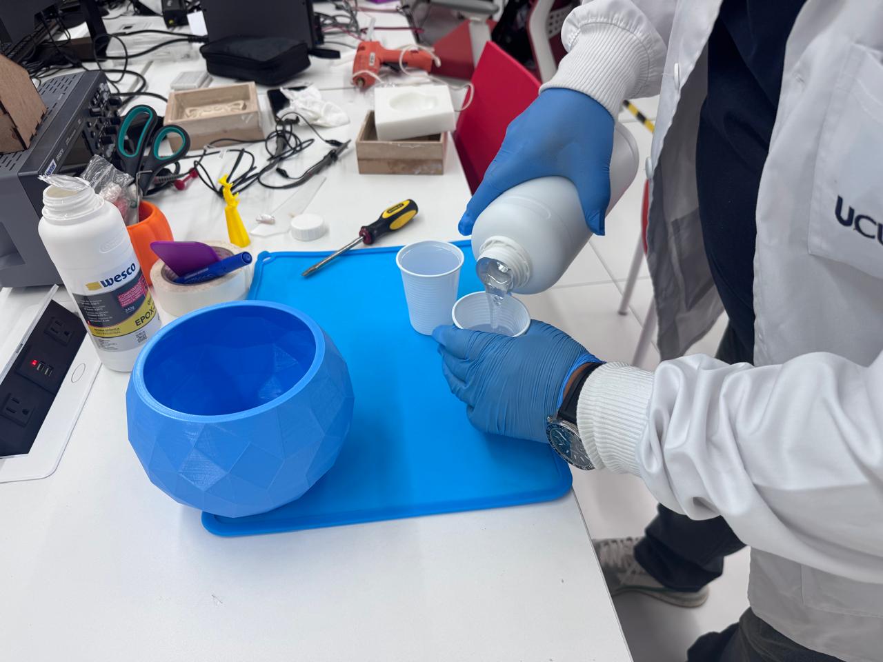 Pouring resin component into a cup