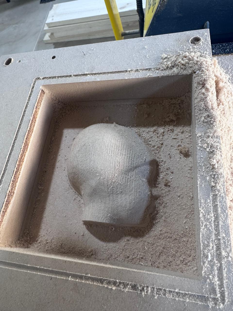 CNC machined base with milling dust